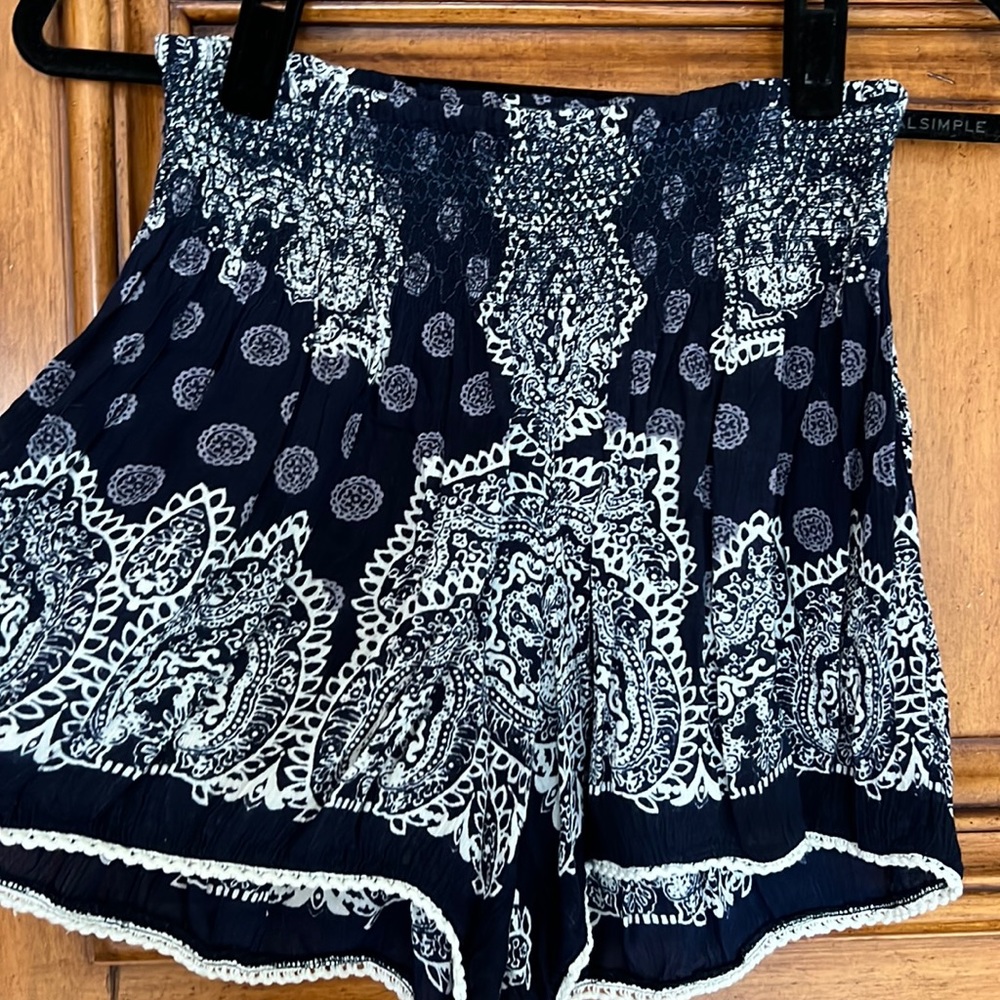 Sassy summer shorts. Navy and white print with smocked waist.